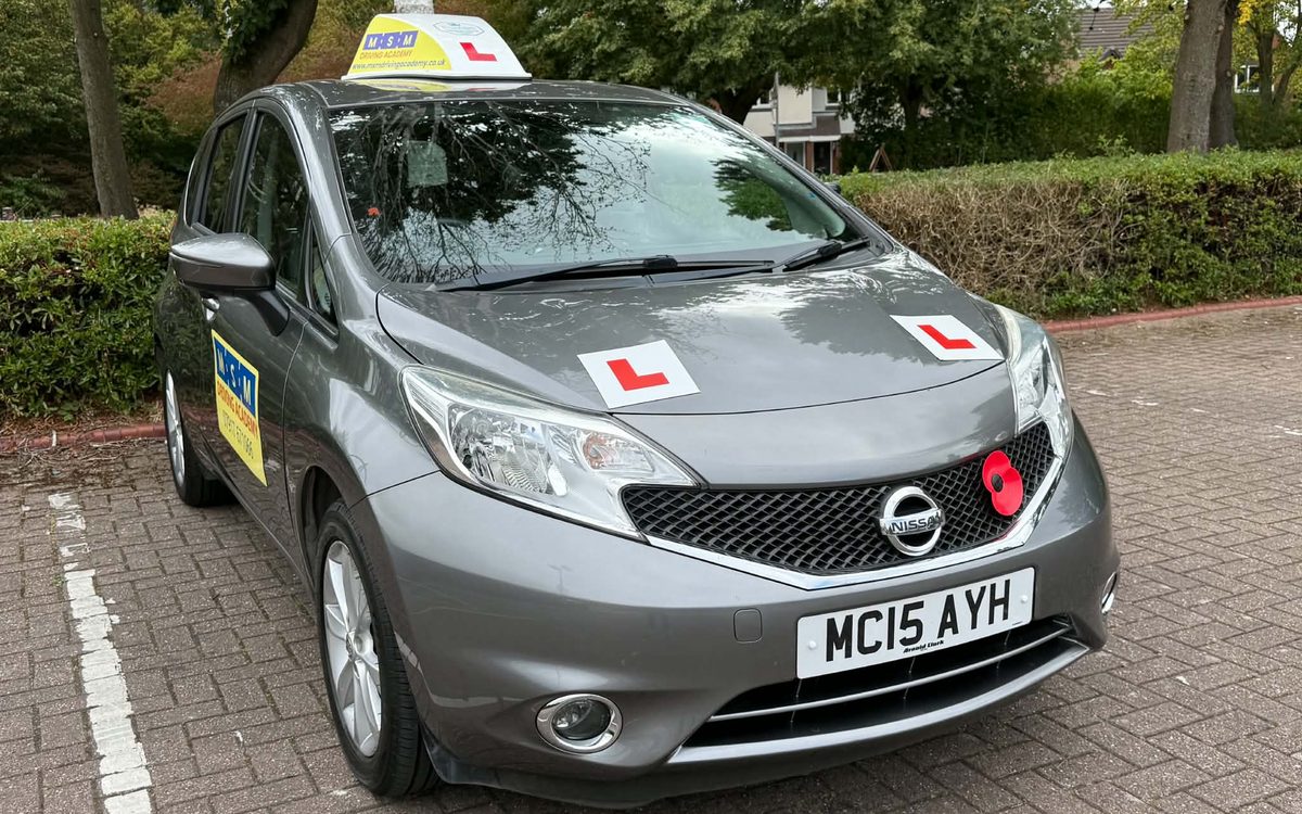Louise's grey Nissan Note automatic tuition car with MSM Driving Academy signage