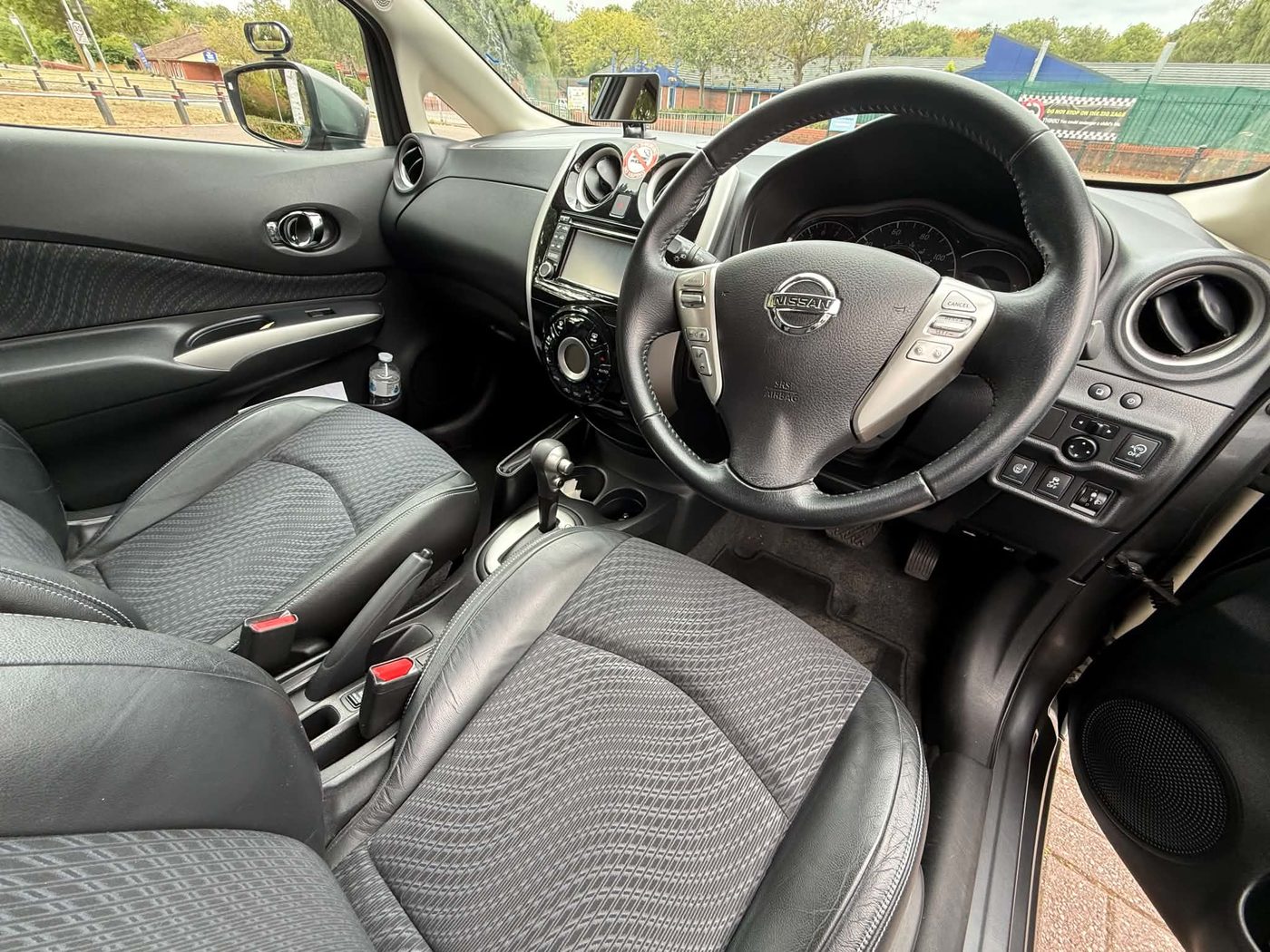 Inside Louise's Nissan Note — steering wheel, controls and dual-control pedals